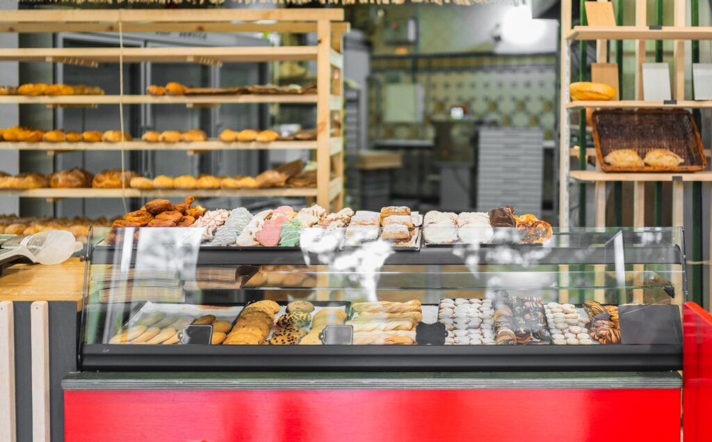 Display case showing delicious pastries and breads in bakery shop